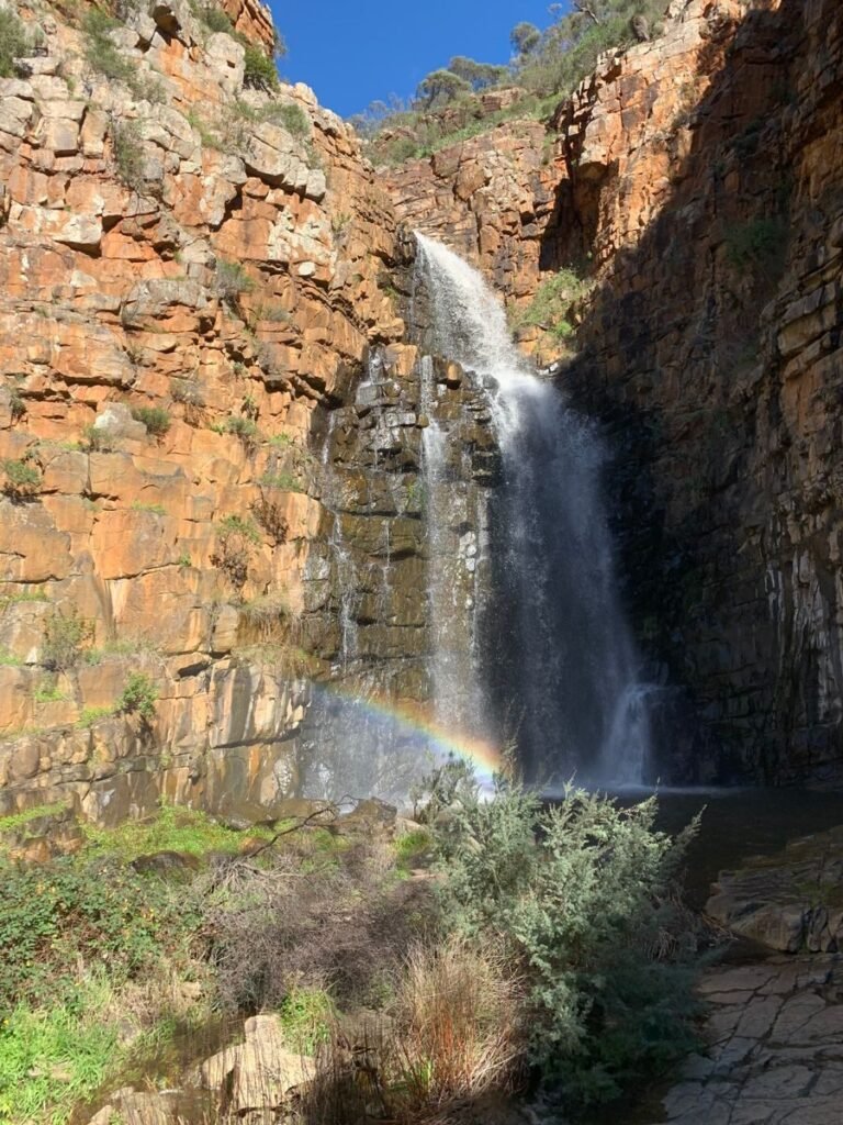 Captivating waterfall cascading over rocky cliffs in Adelaide's Morialta Conservation Park.