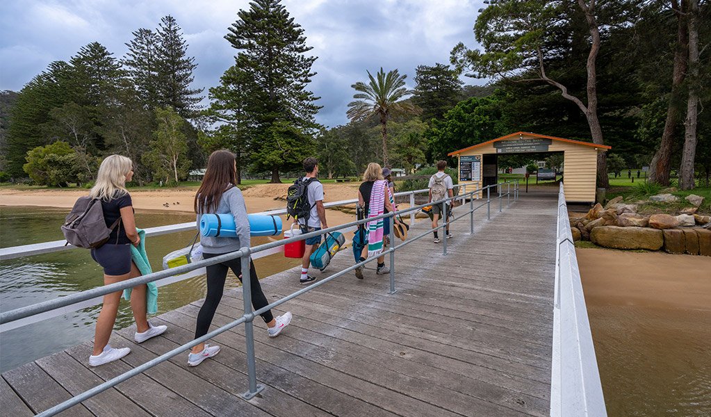 campers walking up The Basin jetty